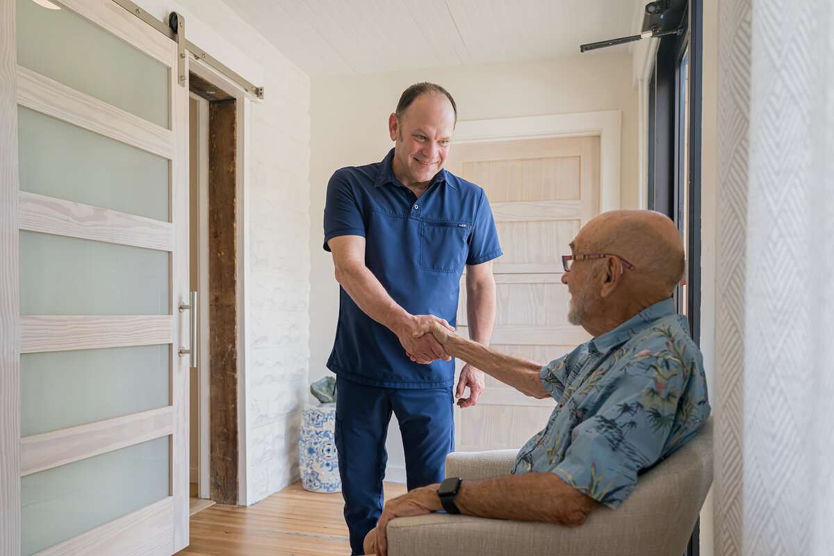 Acupuncturist greeting patient at clinic Asheville NC