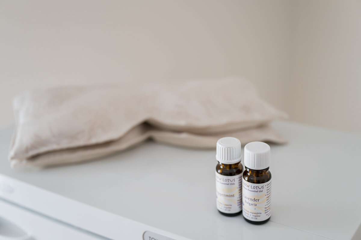 Aromatherapy and eye pillows in a massage therapy room in Asheville, NC