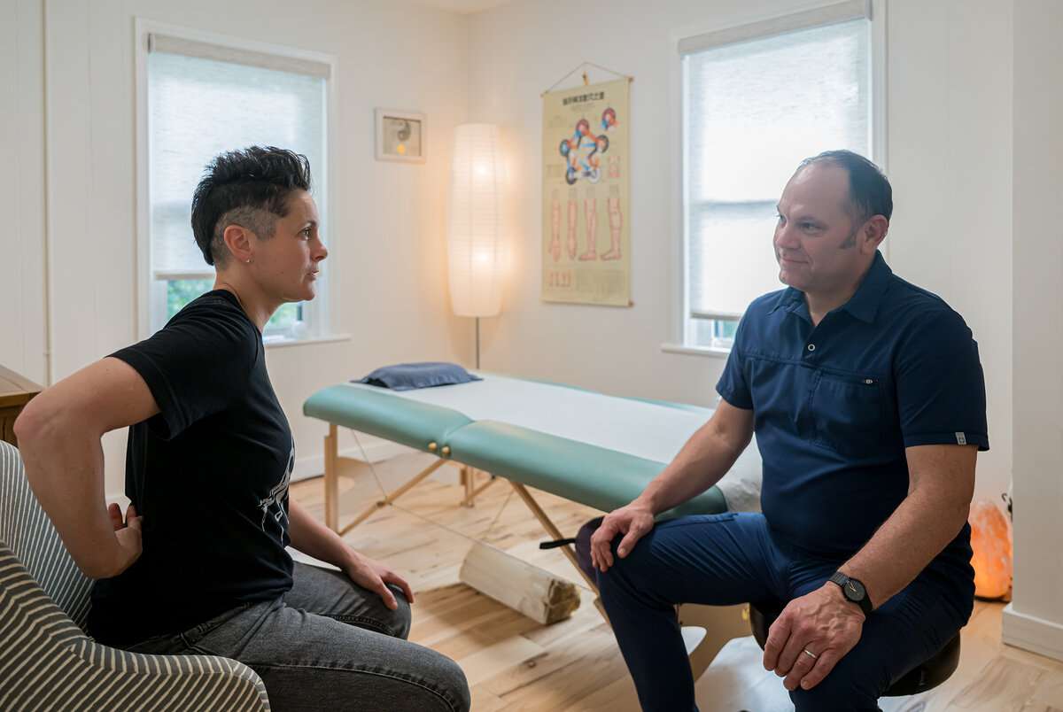 Chad Johnson MS LAc in orthopedic acupuncture consultation Asheville NC