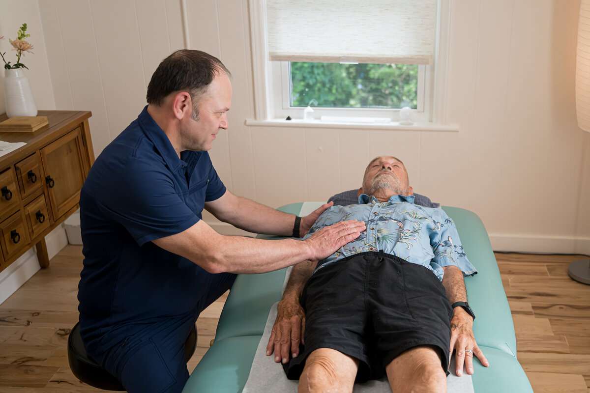 Hands-on orthopedic assessment at acupuncture clinic Asheville NC